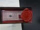 a red wax stamp on a piece of paper