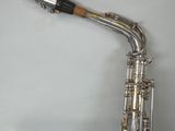 a saxophone that is sitting in a case on a table