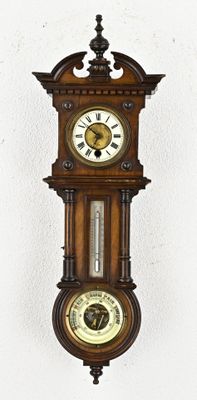 a wooden clock hanging on the wall with a clock on it