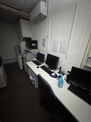 two computers on the desk in the room