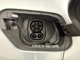 a close up of a car ' s charging station with a car plugged into it