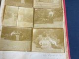an old photo of a book with pictures of people on it