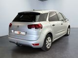 the rear of a silver citrole parked in a garage