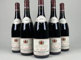 six bottles of wine are lined up in a row
