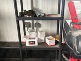 a black shelf with tools on it in a room