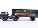 a toy truck that has a box on the back of it