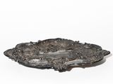 an antique silver plate on a white background with a white background