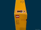 a yellow box with a lego figure inside of it