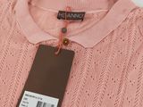 a pink sweater with a tag on it
