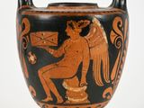 a black and orange vase with an image of an angel on it