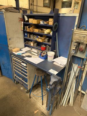 an image of a workbench with a lot of tools on it