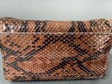 an image of a snake skin purse on a table