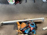 a pile of tools on the ground in a garage
