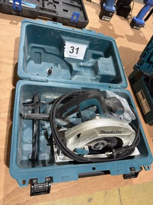 a box with a circular saw and a circular saw blade