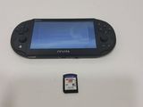 a game controller and a memory card next to it