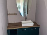 a bathroom with a sink and a mirror on the wall