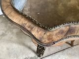 a wooden bench with a mirror on top of it