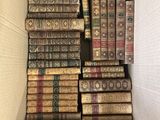 an open box filled with lots of books sitting on top of each other