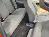 two seats in the back of a red car