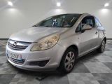 a picture of a silver car parked in a showroom