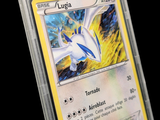 a close up of a pokemon card in a plastic case