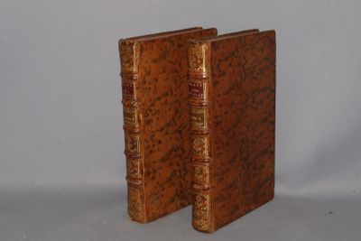 two books that are sitting side by side on a table