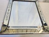 an image of a mirror sitting on top of a white sheet