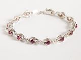 a close up of a bracelet on a white surface