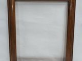 a wooden picture frame with a white background