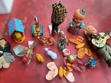 many figurines that are sitting on a red table