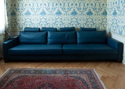 an image of a living room with a blue couch