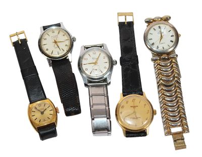 several different types of watches are displayed on a white surface