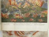 an open book with a drawing of a fire in the middle of it