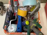a basket full of assorted tools on a table