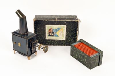 a small box with a picture on it next to a small stove