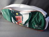 a green and white bag with a red door on it