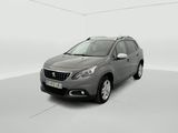 a grey car is parked in a white room with a white floor