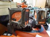 two chainsaws that are sitting on top of a table