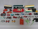 a lot of toy cars and trucks that are on a table