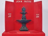jean patou ' s book, the fountain of joy, is on display in a red box