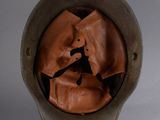a helmet that has a brown leather covering on it