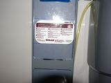 a water heater that is next to a water tank