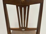 a wooden chair with a star on the back of it