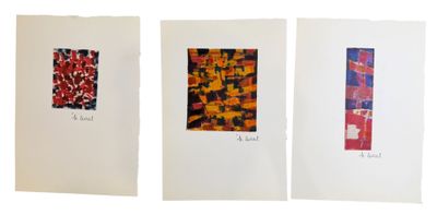 three cards with different designs on them on a white surface