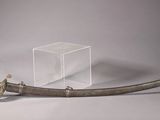an old sword with a clear box on top of it