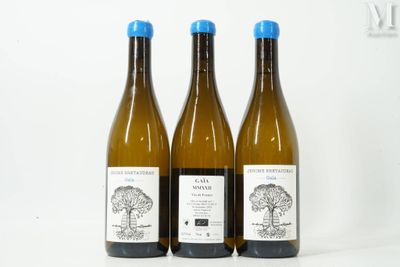 three bottles of wine sitting next to each other on a table