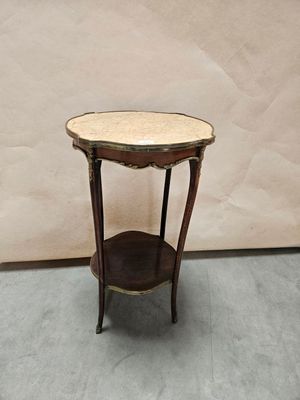 a small table with a marble top on it