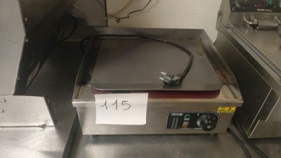 stainless steel counter top with a fryer on it with a price tag on it