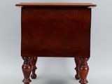 an antique wooden side table with turned legs and a wooden top