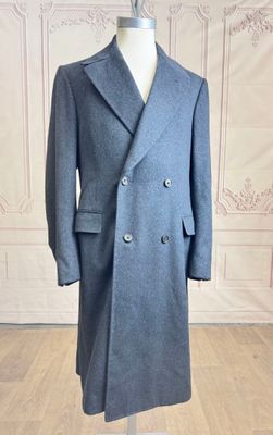an image of a coat on a mannequin stand